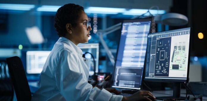 computer scientist working at a computer station