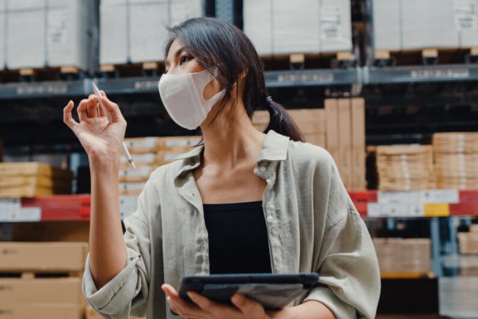 woman sourcing agent in warehouse