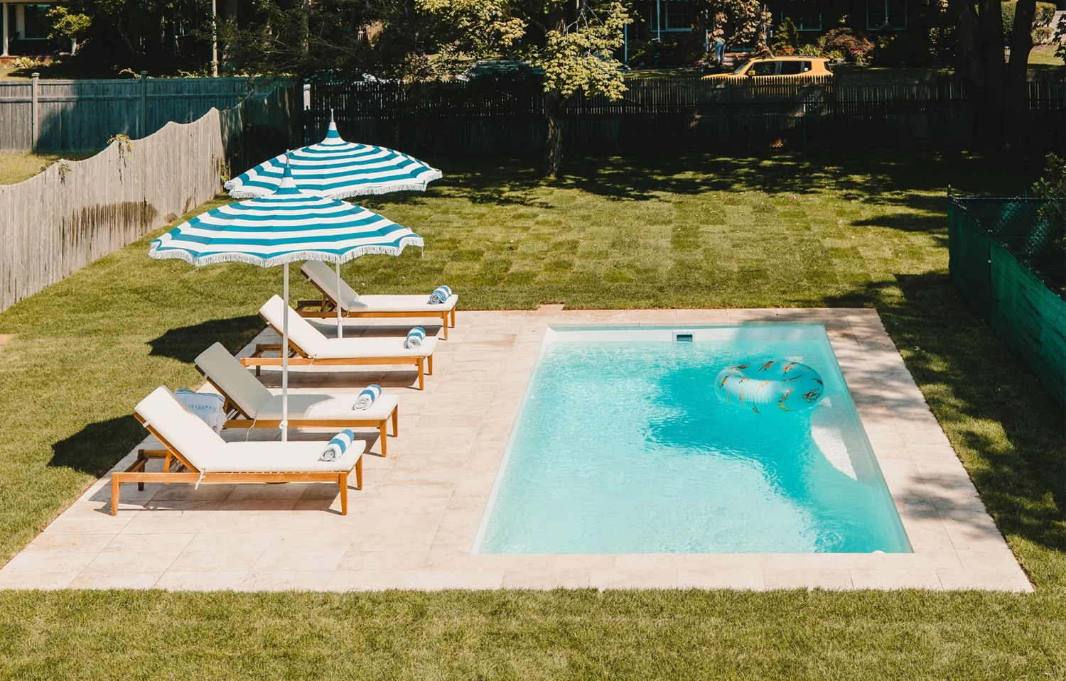 fiberglass pool in backyard scaled